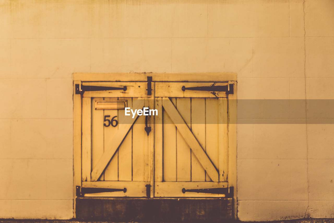 Closed wooden door of building