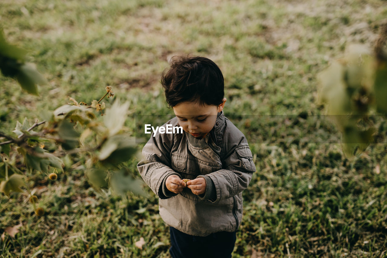 High angle view of boy playing at park