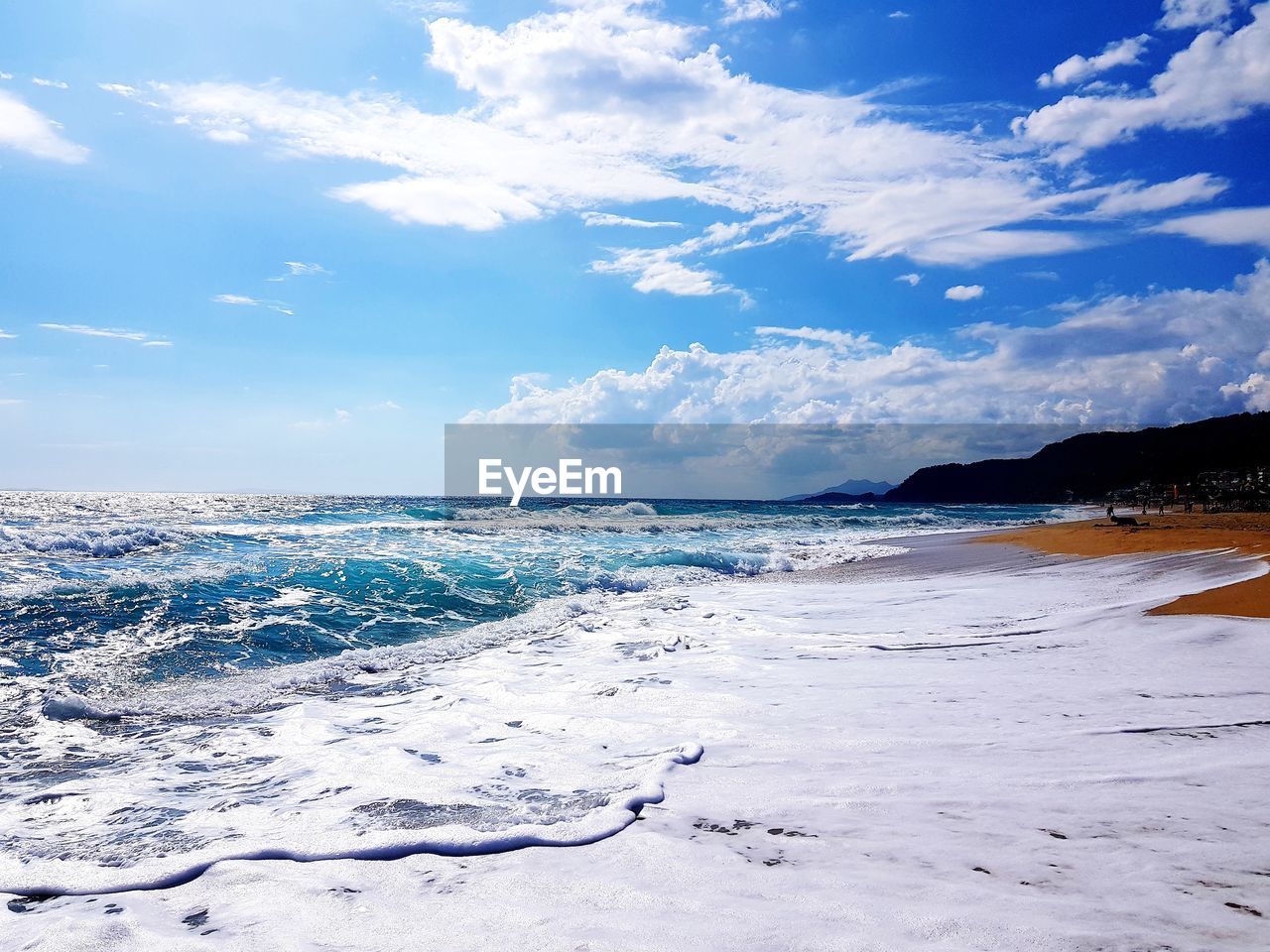 PANORAMIC VIEW OF BEACH AGAINST SKY