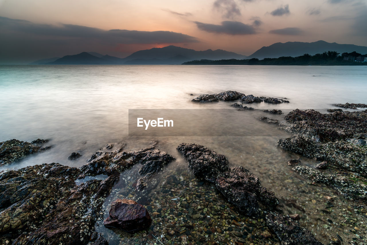 Scenic view of sea against sky during sunset