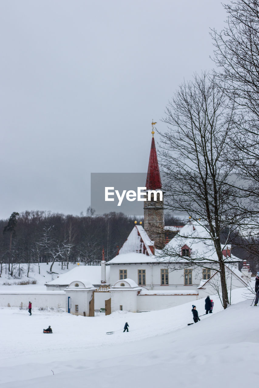 Building against sky during winter