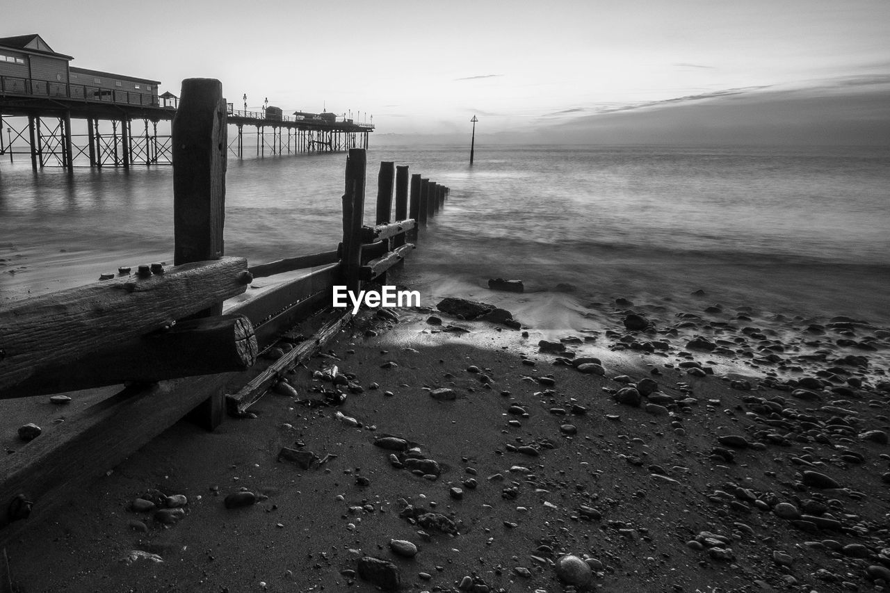 Pier over sea against sky