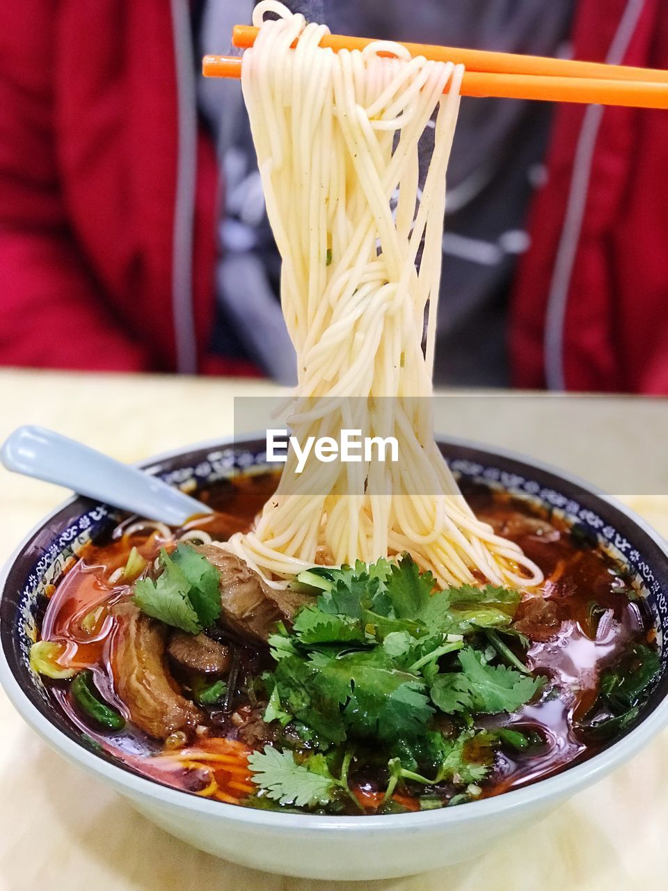 CLOSE-UP OF SOUP IN BOWL ON TABLE