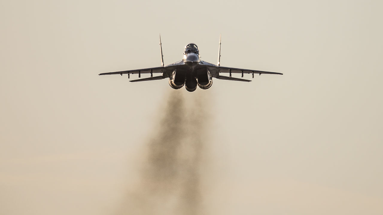 flying, low angle view, airplane, transportation, mid-air, air vehicle, mode of transport, sky, clear sky, outdoors, no people, day