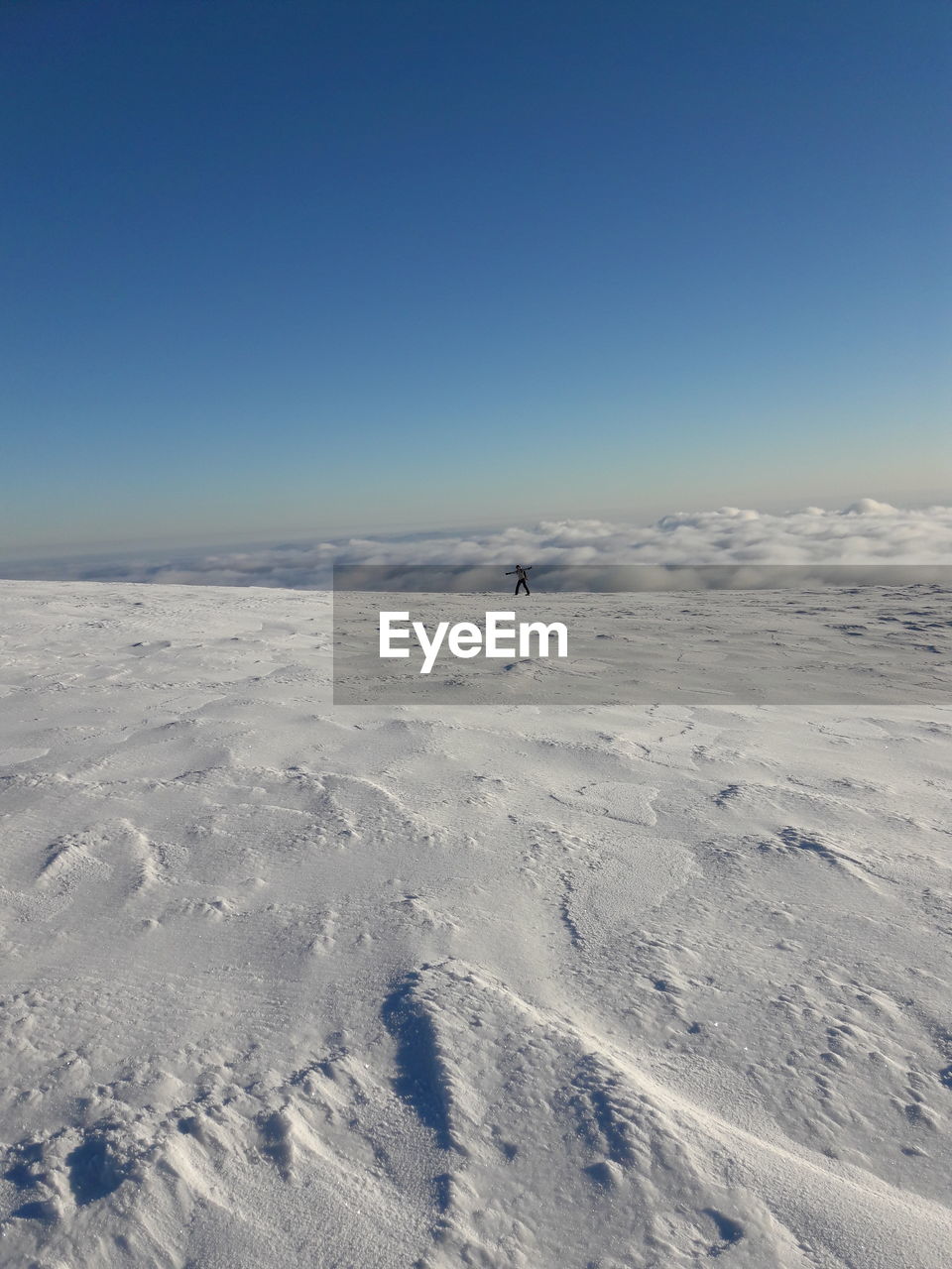 Scenic view of snowy landscape against clear sky
