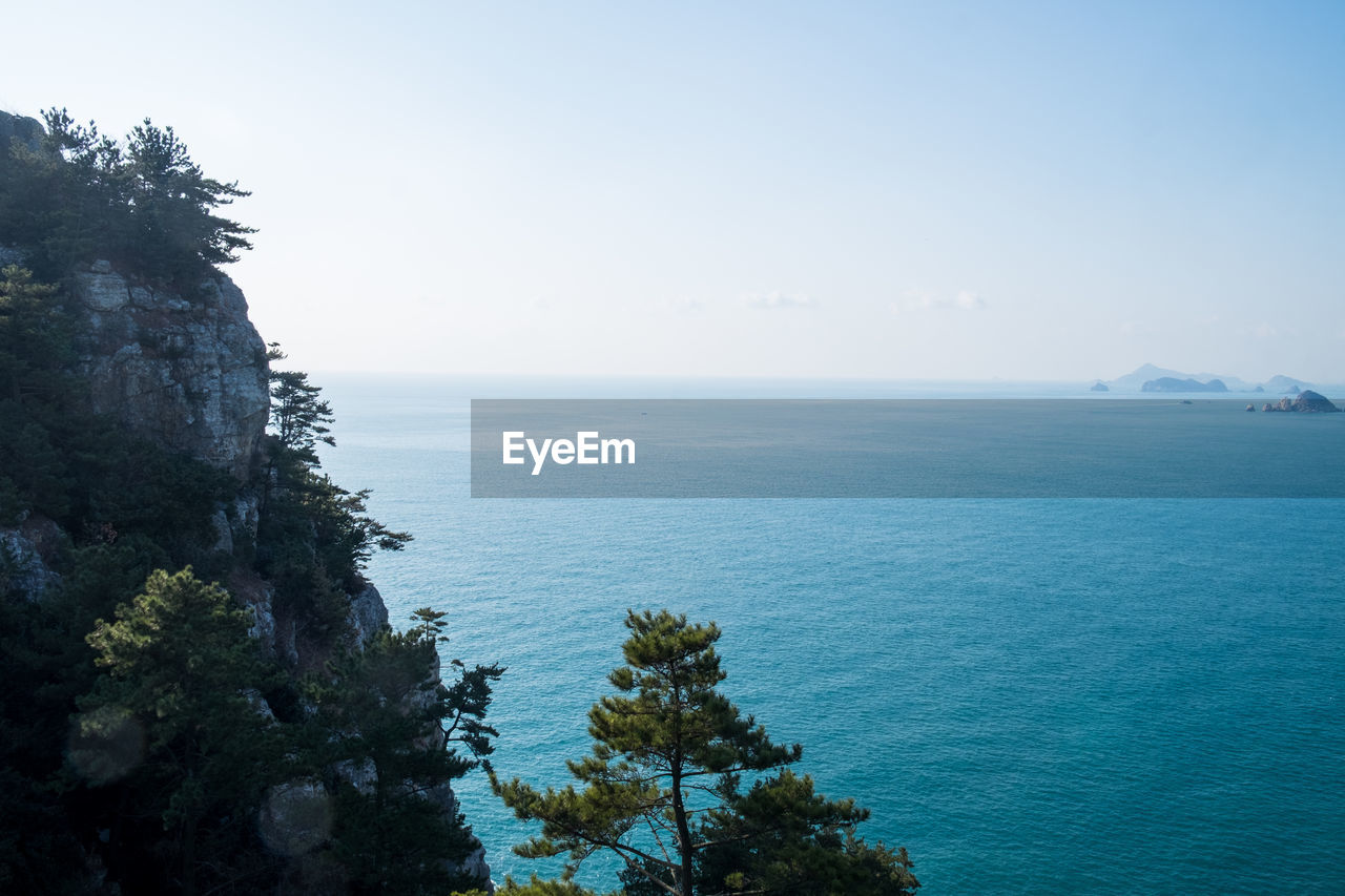 SCENIC VIEW OF CLOUDY SKY OVER SEA