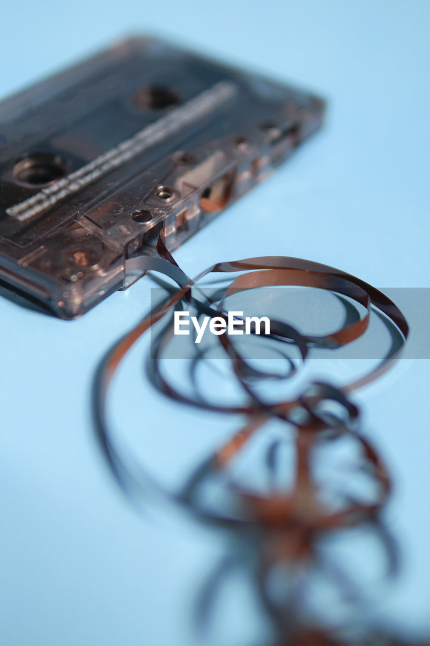 Close-up of damaged audio cassette on table