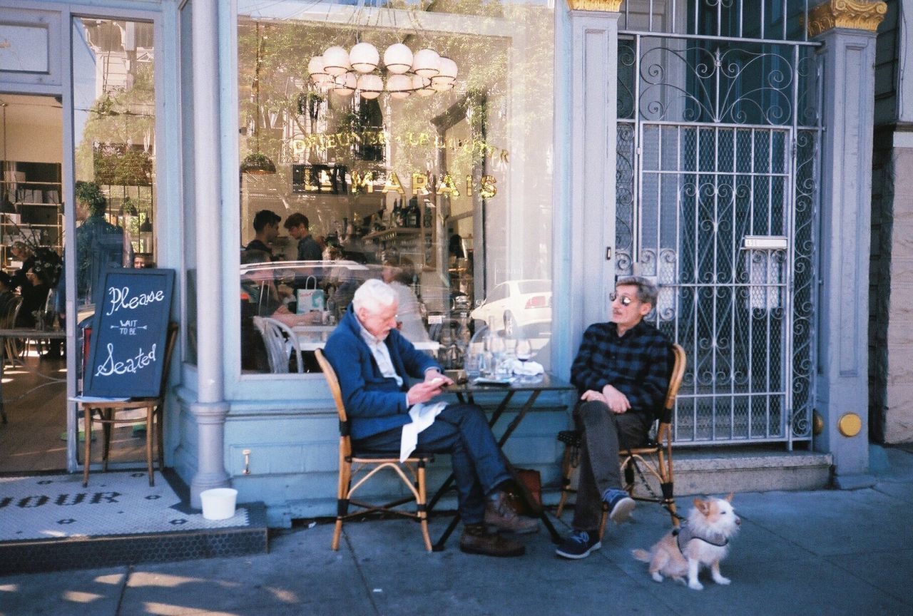 PEOPLE SITTING IN CAFE