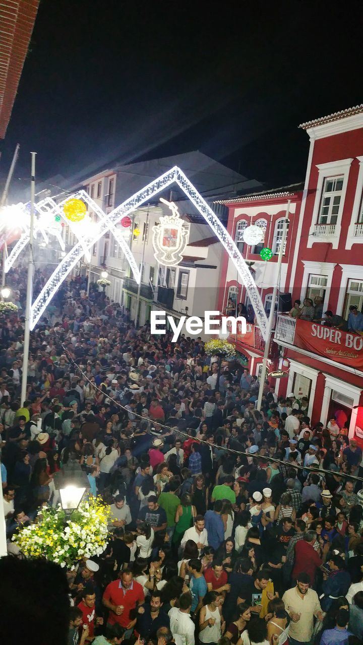 Crowd in illuminated city