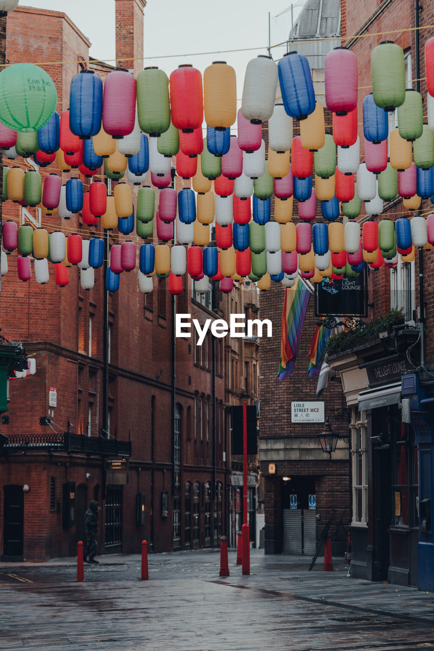 Rainbow coloured lanterns on an empty street in chinatown, london, uk.