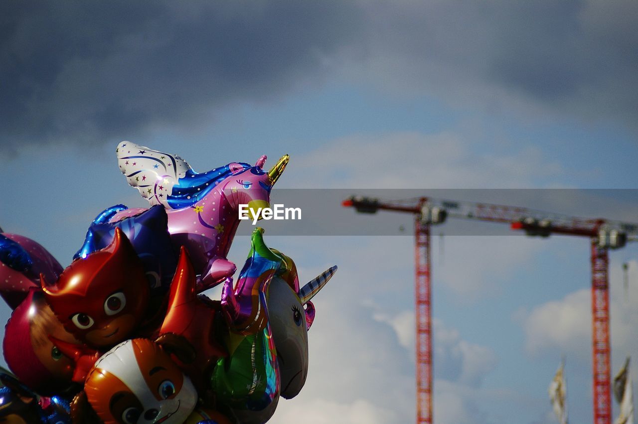 Low angle view of amusement park ride against sky