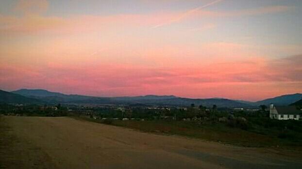 SCENIC VIEW OF MOUNTAINS AT SUNSET