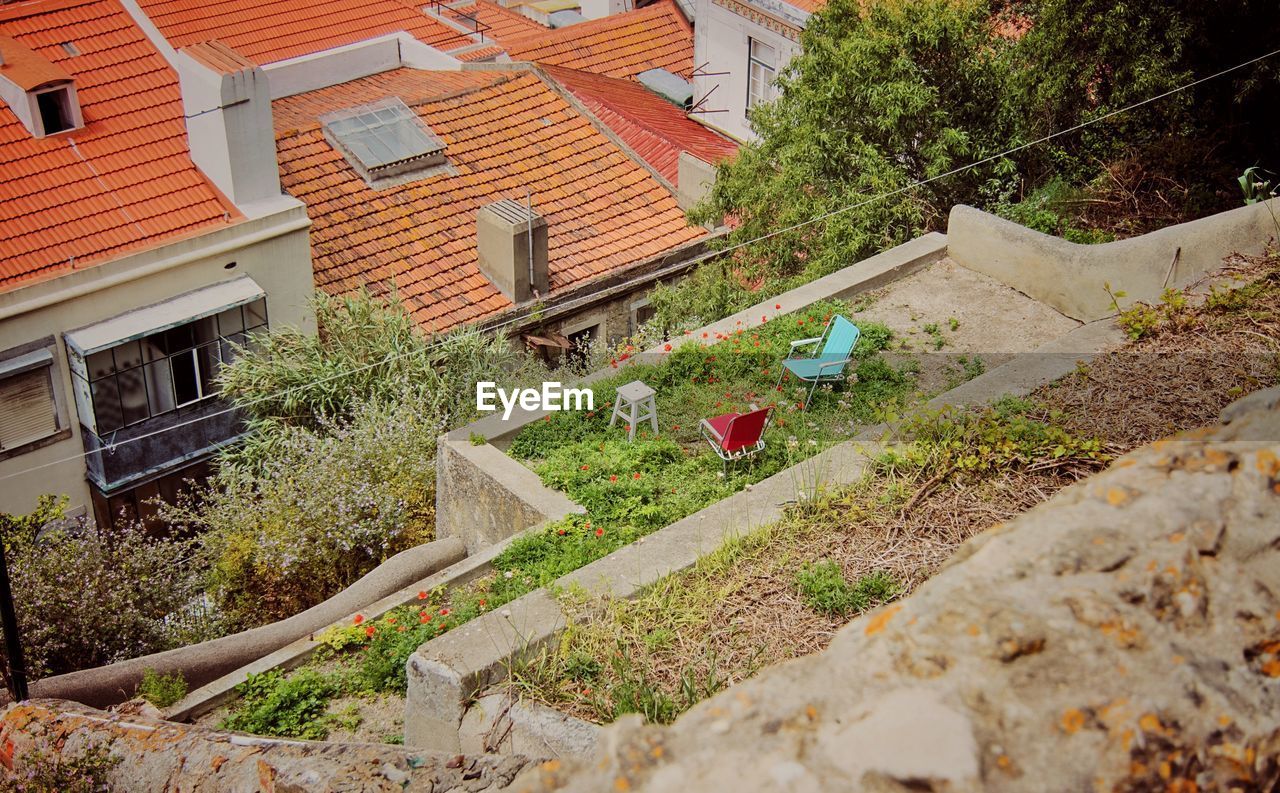 High angle view of chairs on building terrace