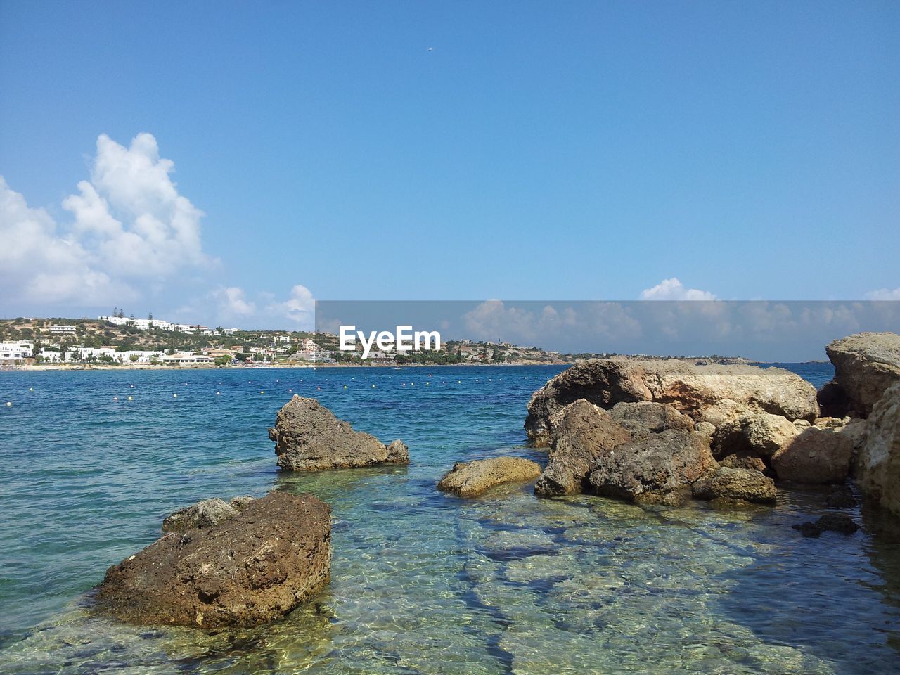 Scenic view of sea against blue sky