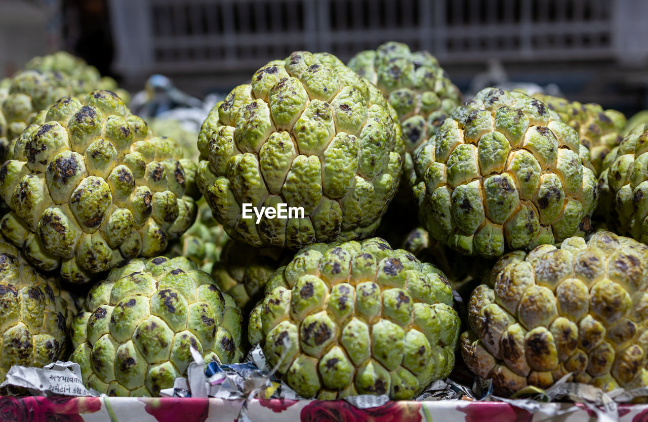 food and drink, food, freshness, healthy eating, market, produce, wellbeing, retail, market stall, large group of objects, vegetable, no people, for sale, abundance, flower, plant, green, fruit, business, close-up, artichoke, heap, small business, day, organic