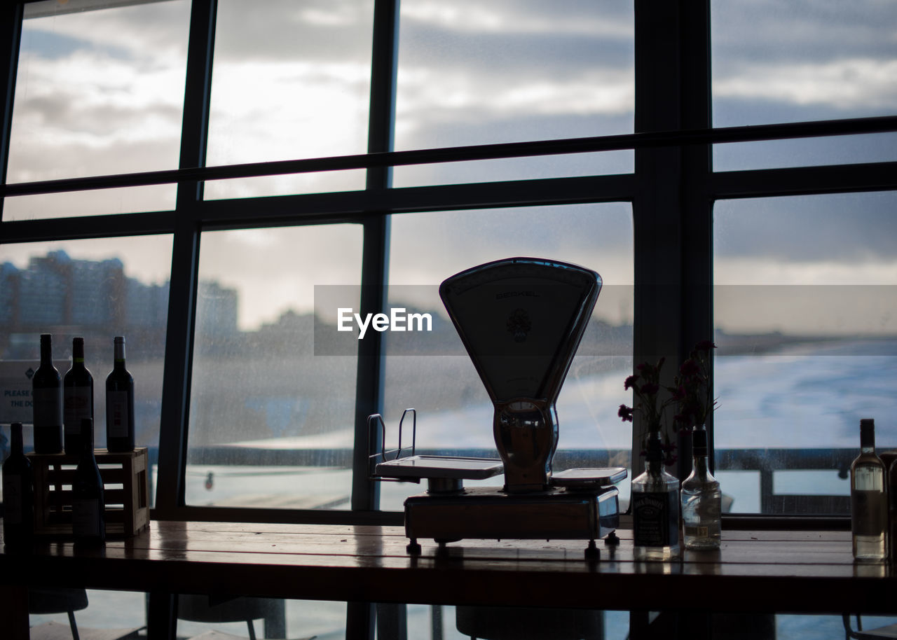 Equipment on table against sky during sunset