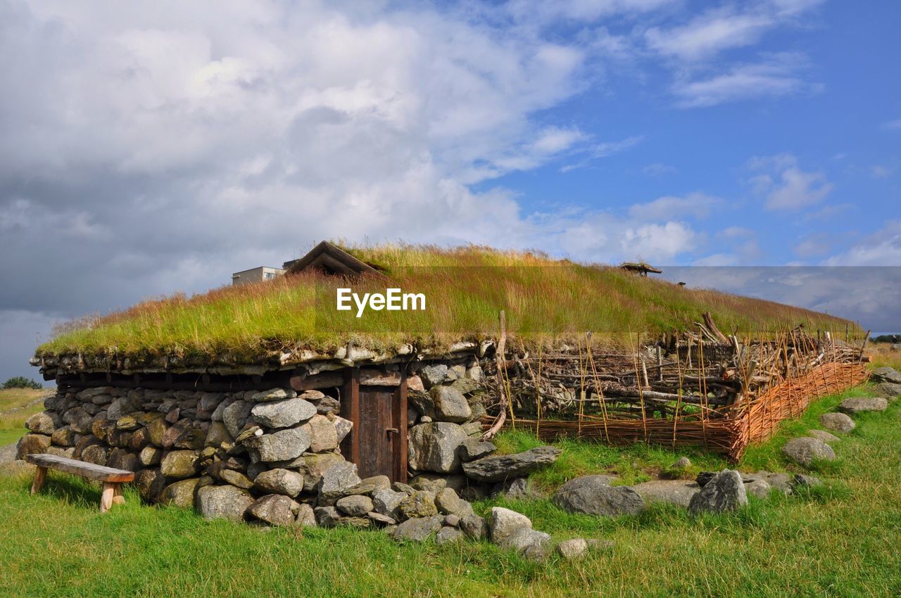 STONE HOUSE AGAINST SKY