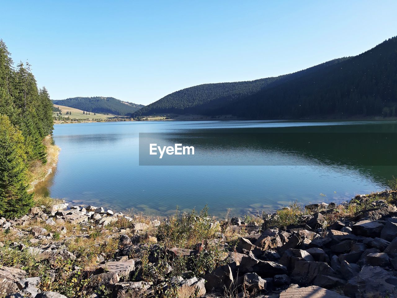 Scenic view of lake against clear sky