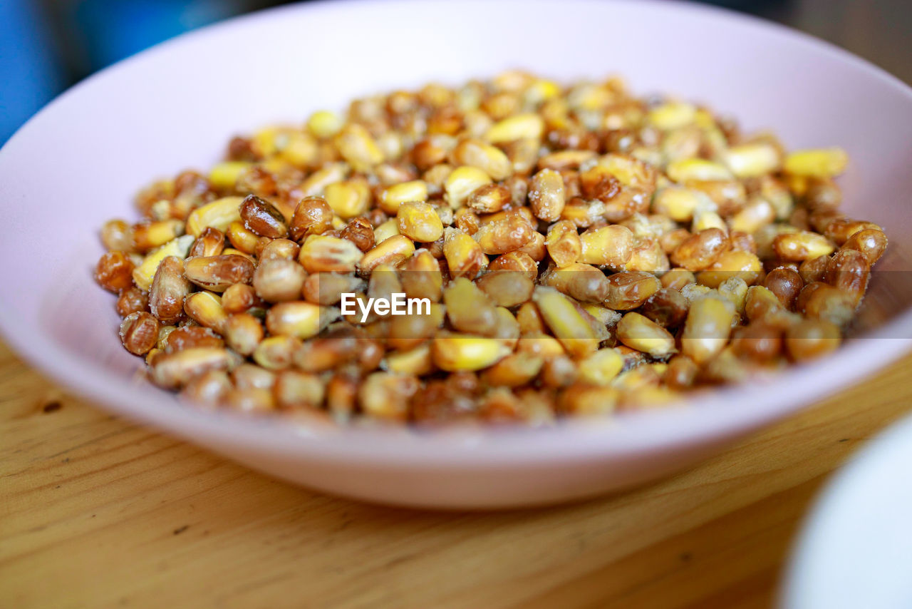 food and drink, food, healthy eating, dish, wellbeing, freshness, produce, crop, vegetarian food, bowl, selective focus, plant, close-up, breakfast, fruit, meal, indoors, no people, snack, vegetable, cuisine, table, wood, nut