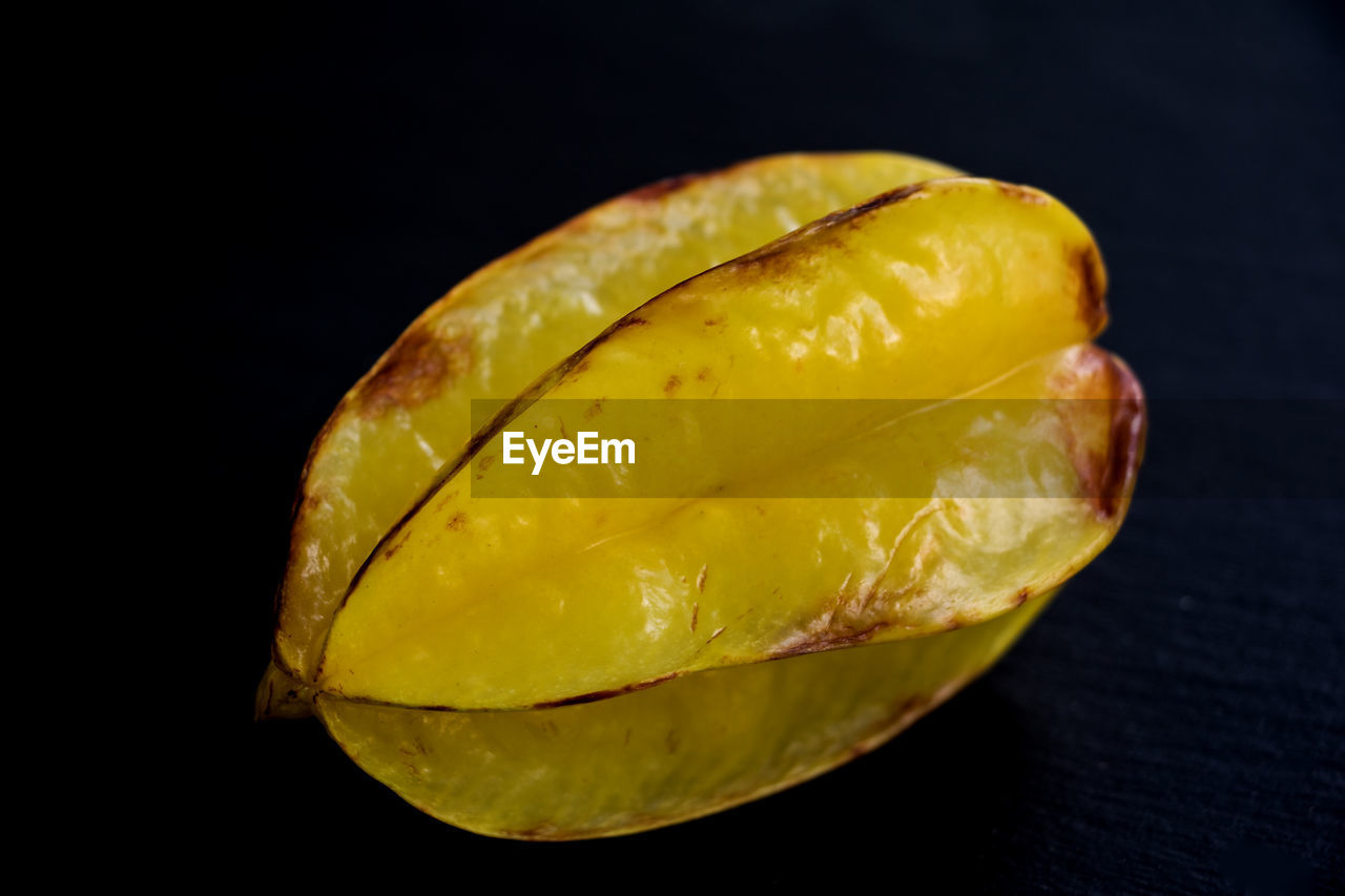 yellow, plant, food and drink, food, healthy eating, fruit, black background, produce, studio shot, freshness, wellbeing, indoors, macro photography, close-up, no people, single object, leaf, tropical fruit, cut out, flower, slice, still life