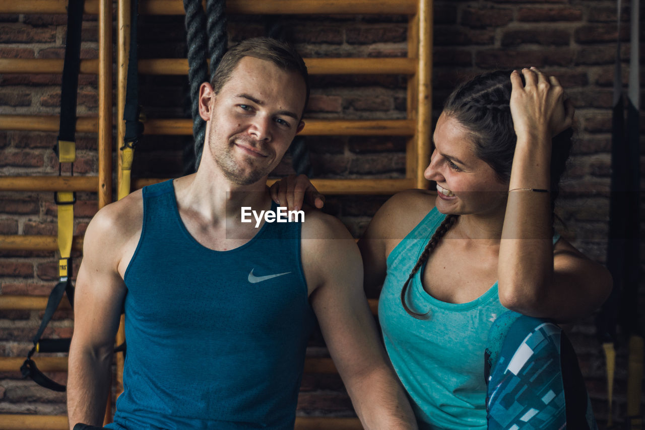 YOUNG MAN AND WOMAN WEARING MASK