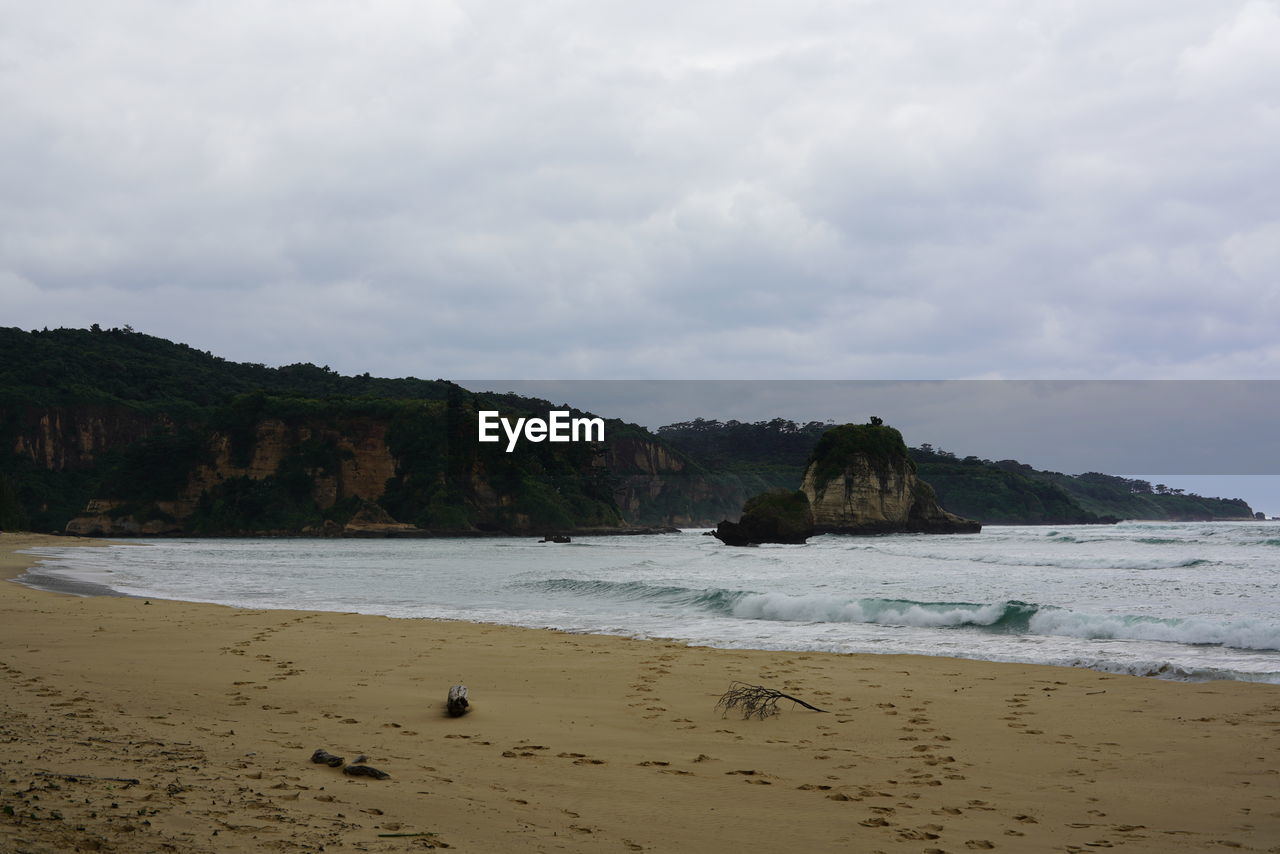 Scenic view of beach against sky