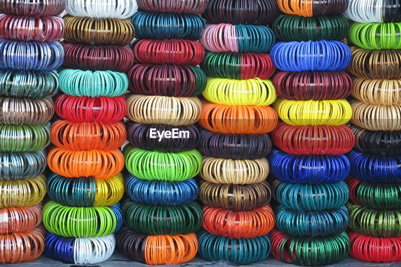 Full frame shot of multi colored bangles for sale at market