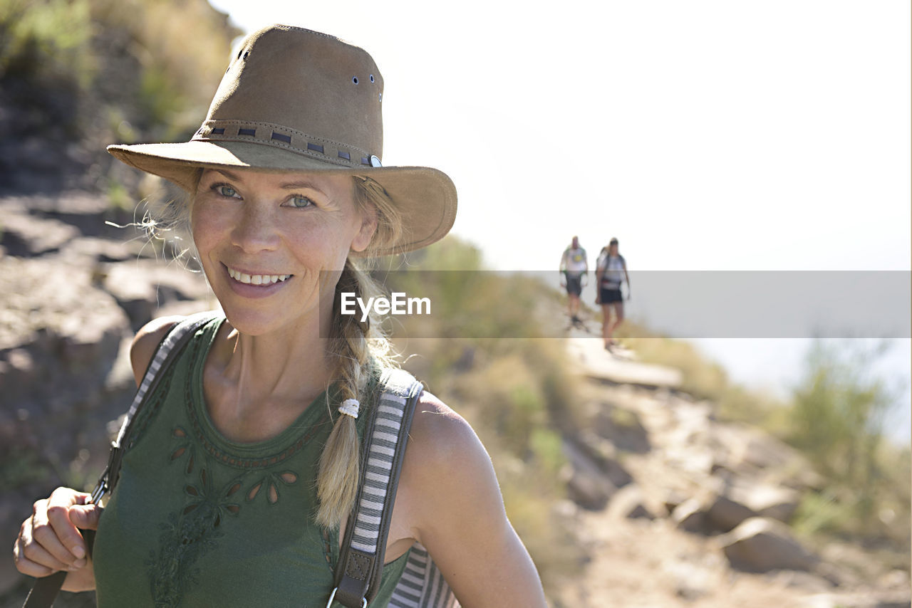 Portrait of smiling woman on a hiking trip