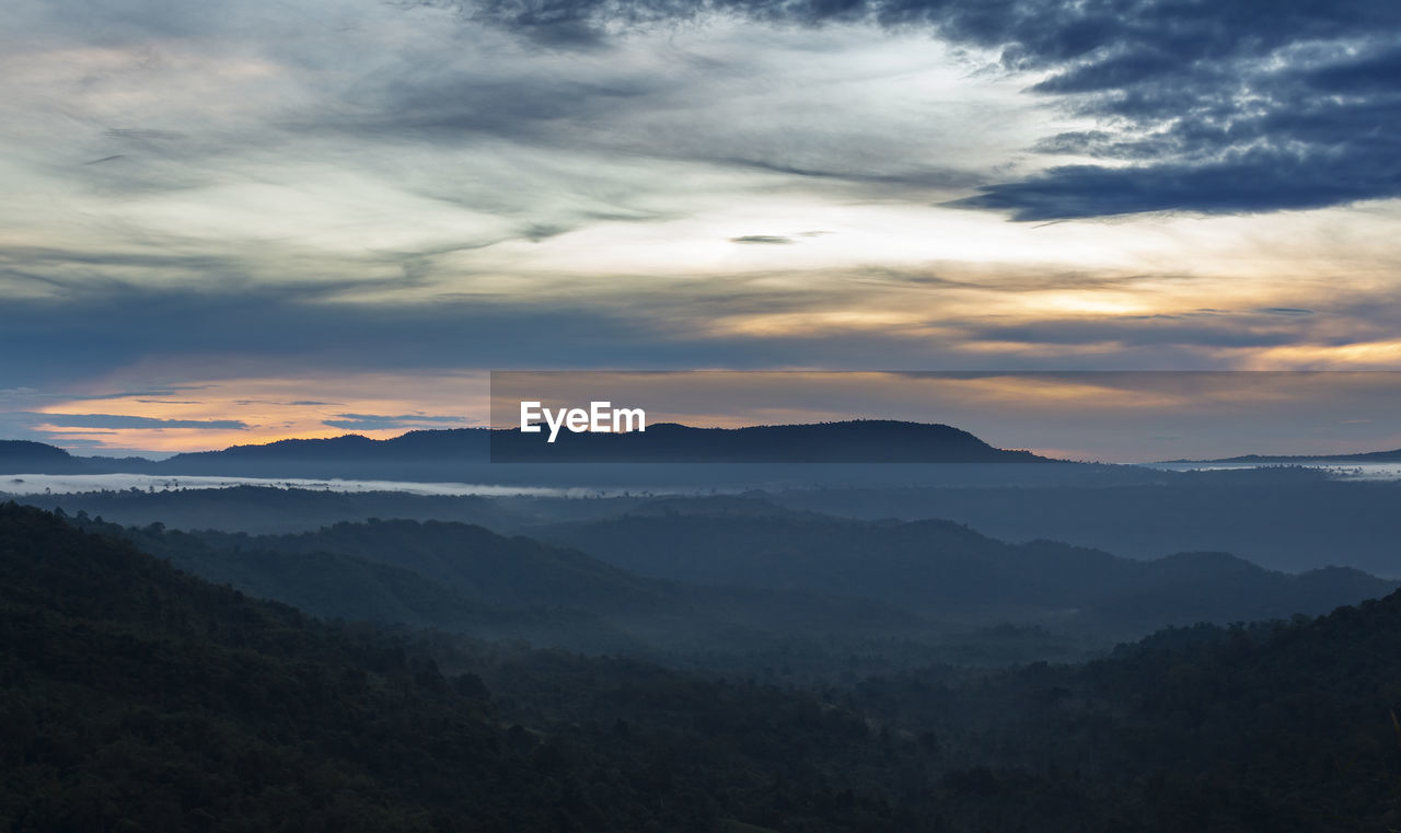 Scenic view of mountains against sky during sunset