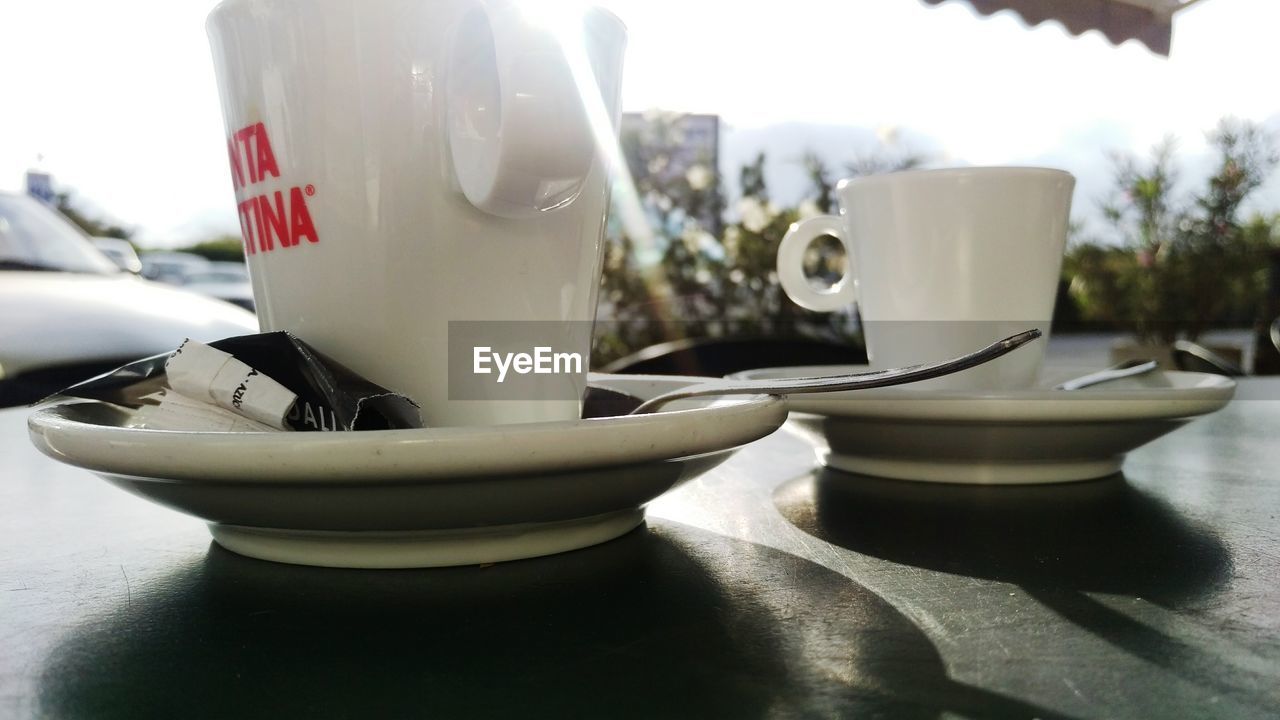 COFFEE CUP ON TABLE