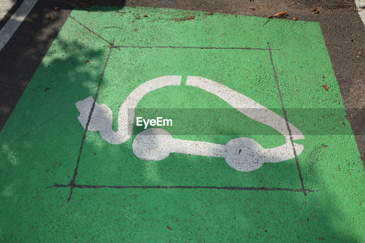 Electrical vehicle charging station sign on the ground in france