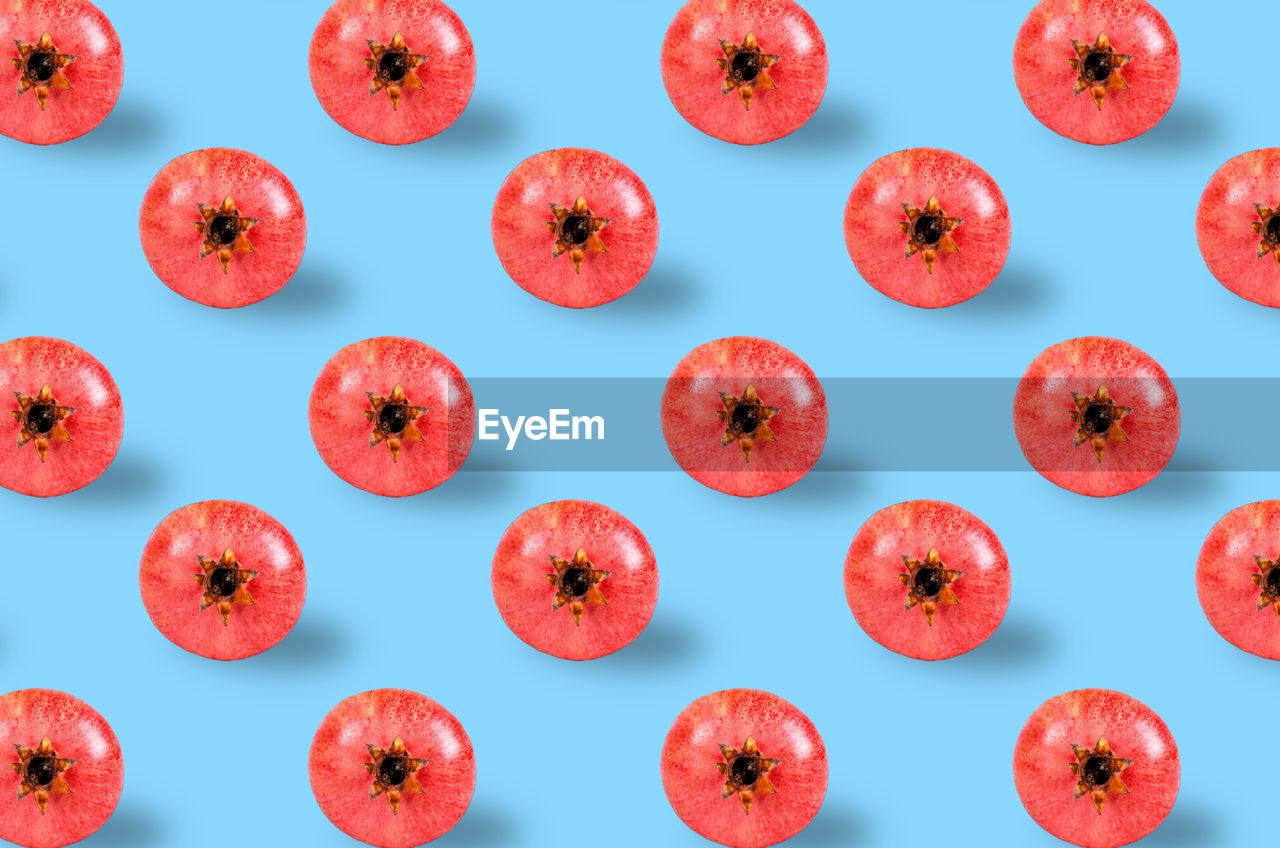 DIRECTLY ABOVE SHOT OF RED FRUITS ON WHITE