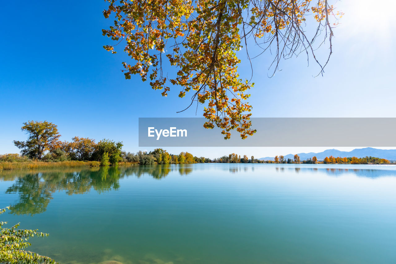 Scenic view of lake against sky during autumn