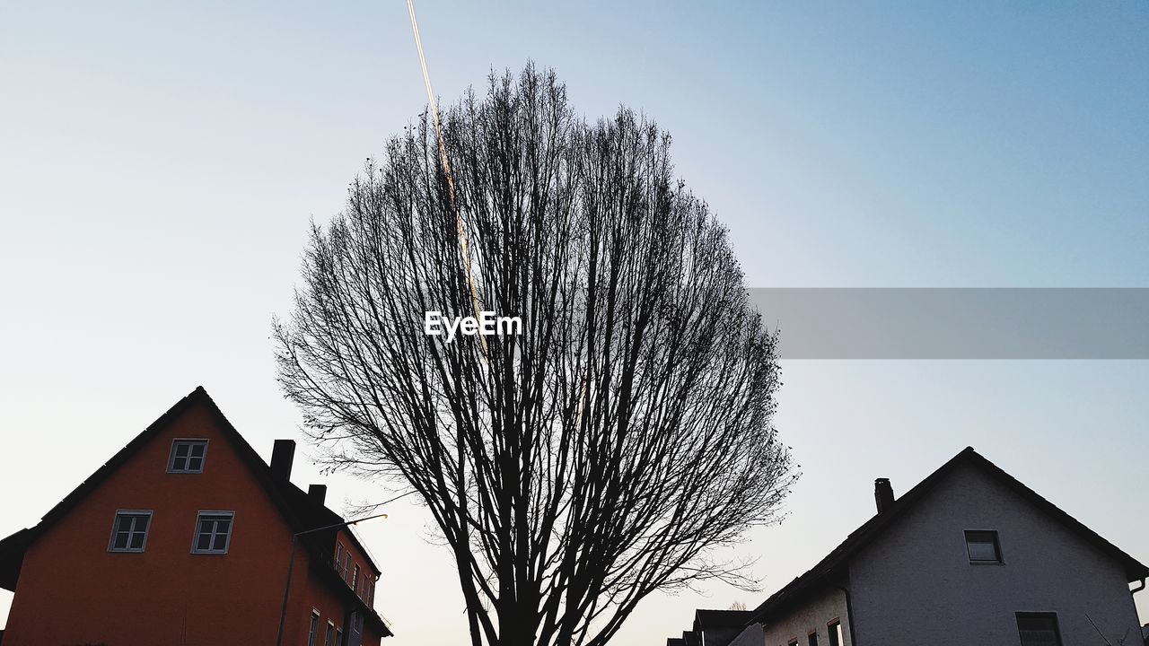 LOW ANGLE VIEW OF CITY AGAINST CLEAR SKY