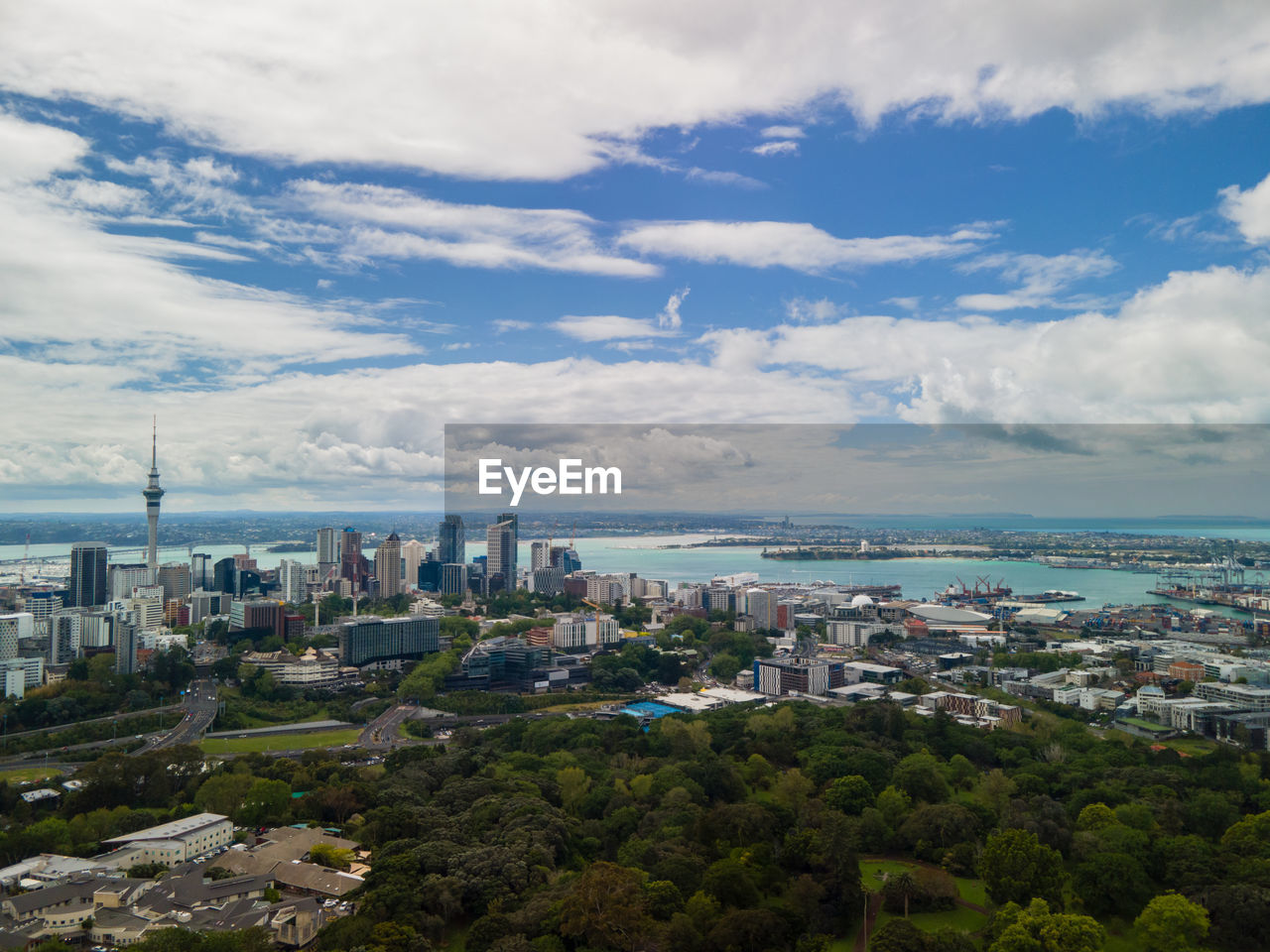 high angle view of cityscape against cloudy sky