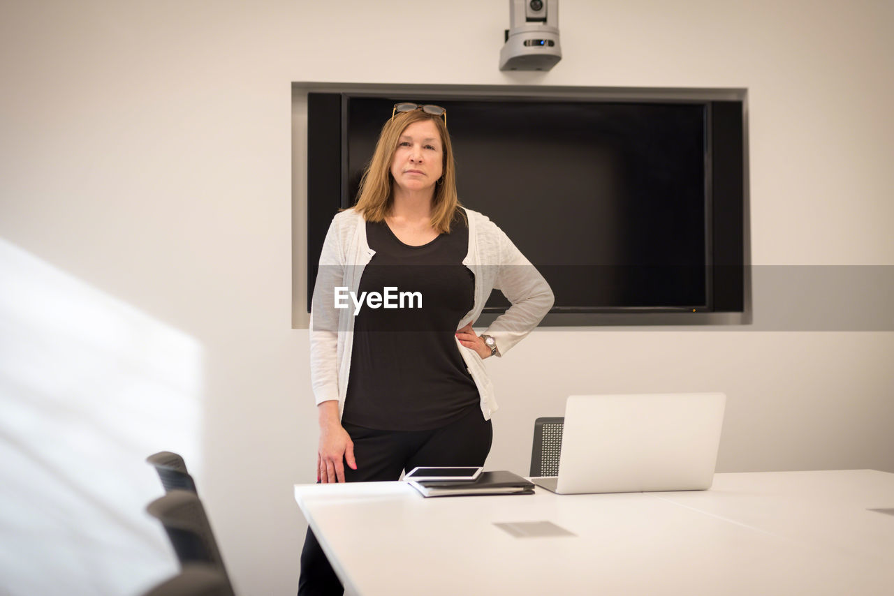 Portrait of businesswoman standing in office