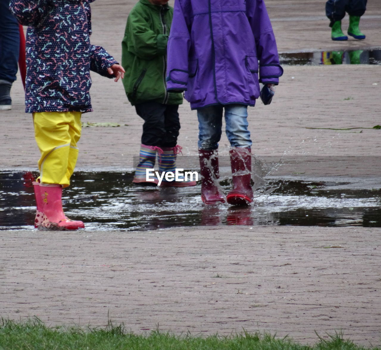 LOW SECTION OF PEOPLE STANDING OUTDOORS