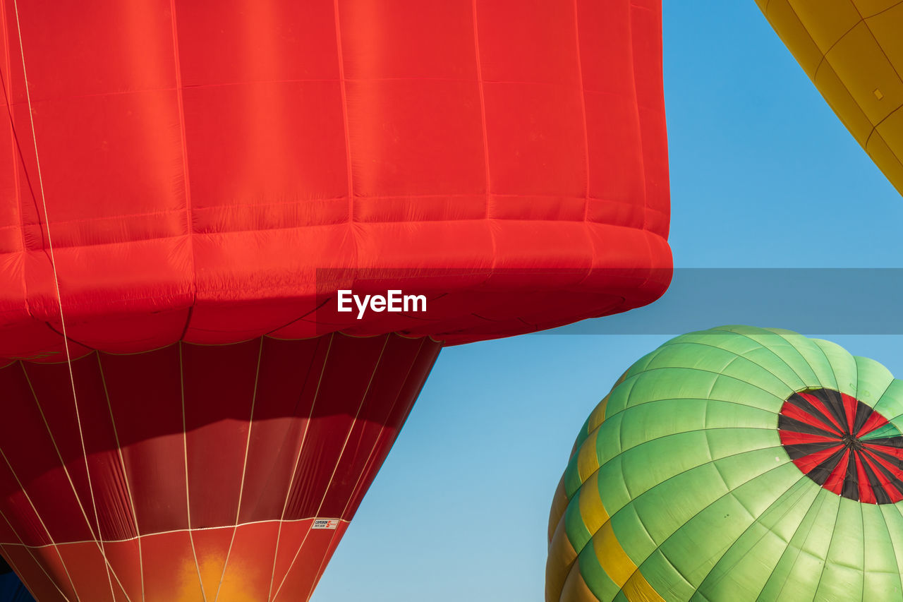 Low angle view of hot air balloon against blue sky