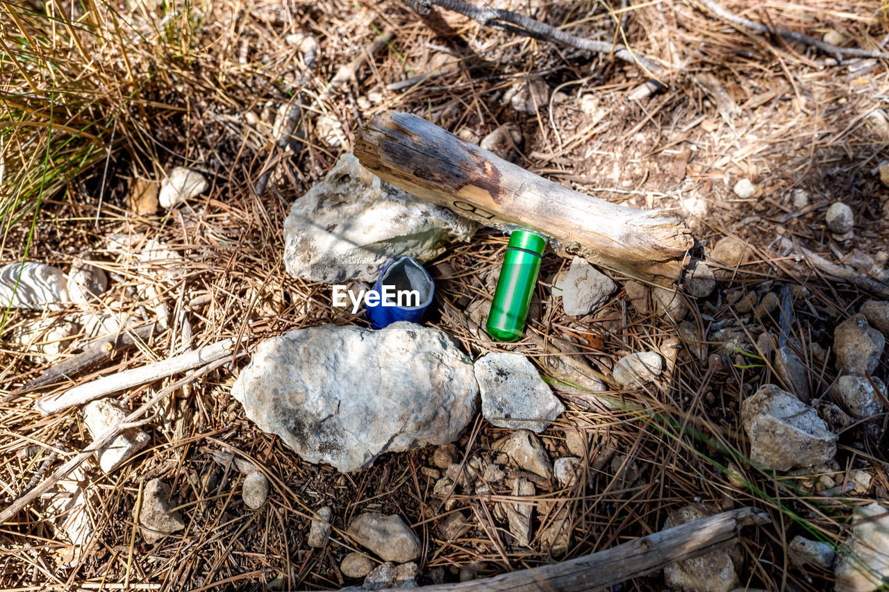 HIGH ANGLE VIEW OF A BOTTLE OF A METAL