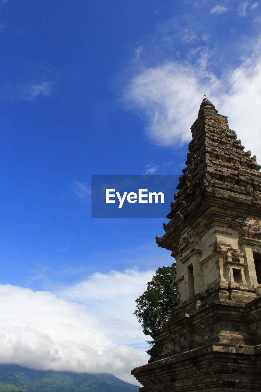 Low angle view of historic temple against sky