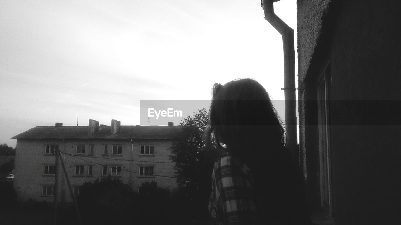 VIEW OF BUILDINGS THROUGH WINDOW