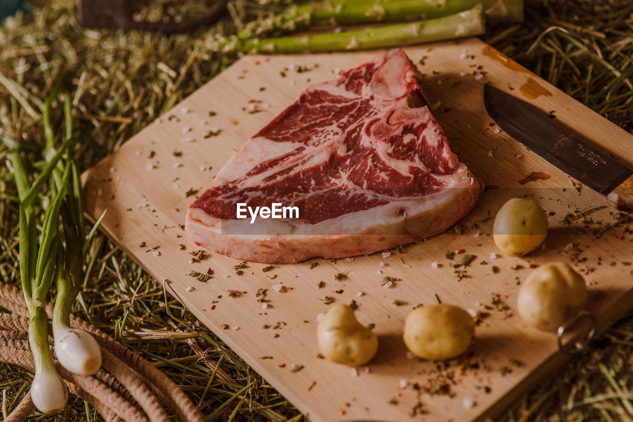 Close-up of meat on cutting board