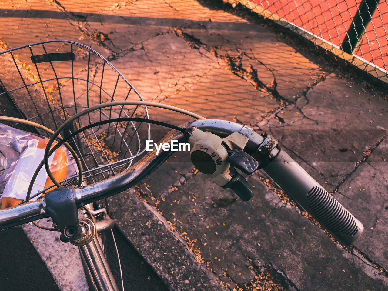 High angle view of bicycle parked by sidewalk