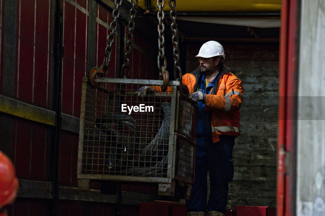 Industry, worker and indoor crane