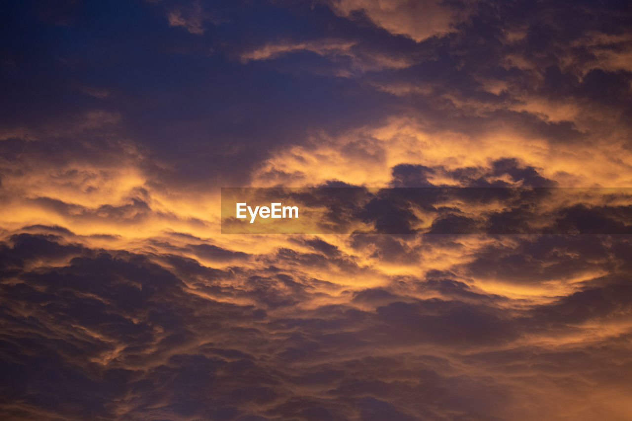 Low angle view of clouds in sky during sunset