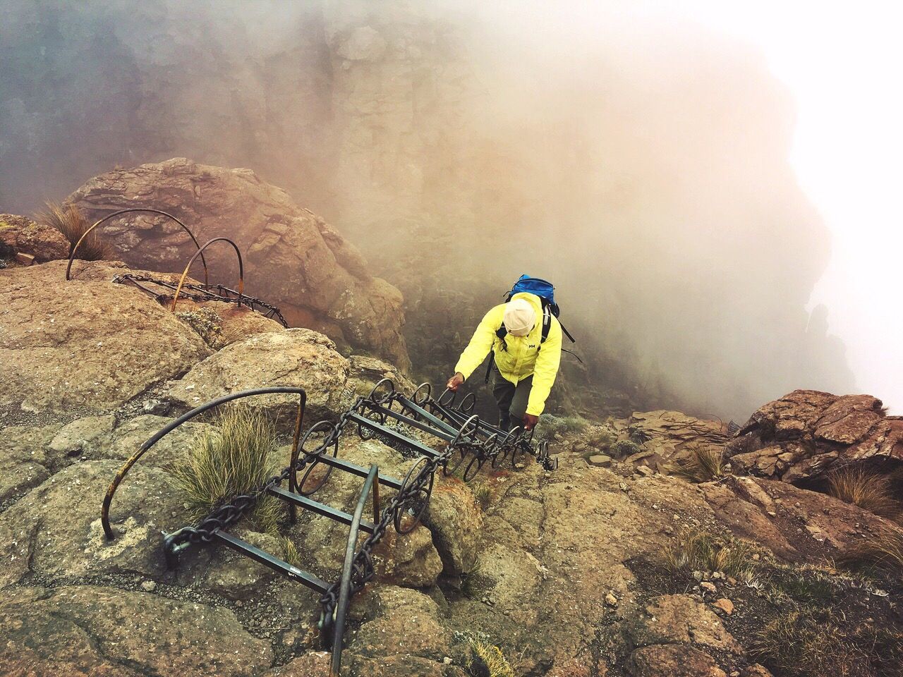 MAN WORKING ON MOUNTAIN