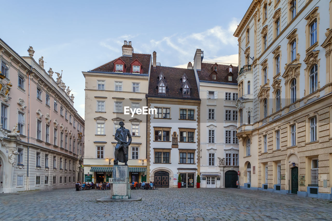 STREET AMIDST BUILDINGS IN CITY