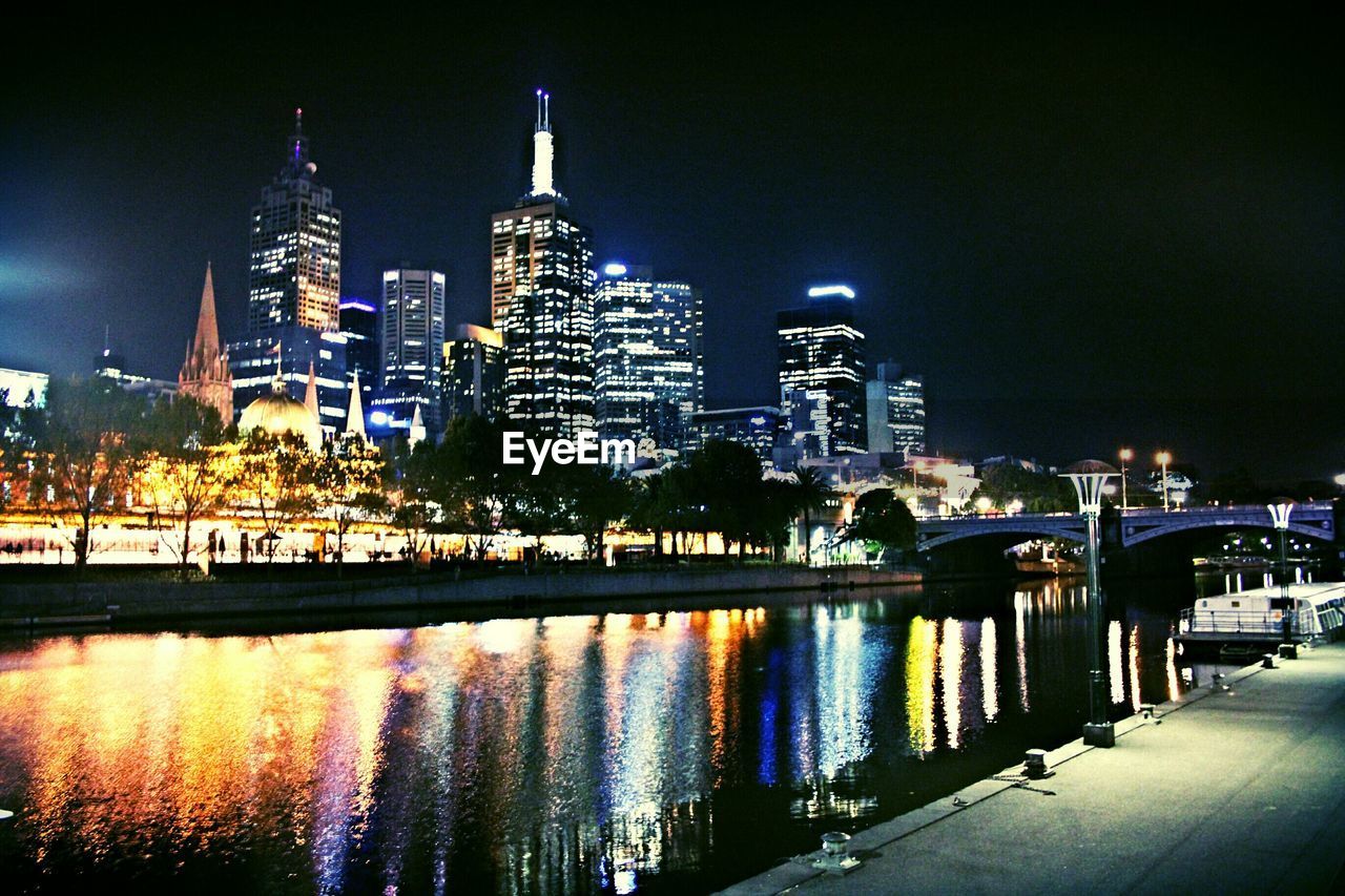 ILLUMINATED CITYSCAPE AT NIGHT