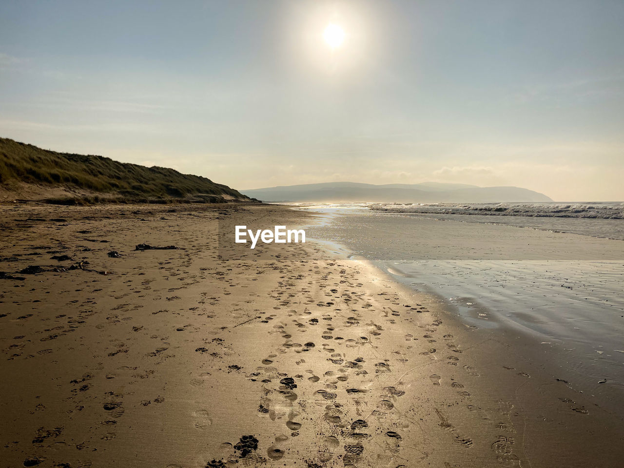 SCENIC VIEW OF SEA AGAINST SKY AT SUNSET