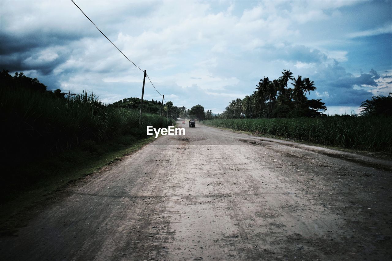 ROAD IN FIELD AGAINST SKY